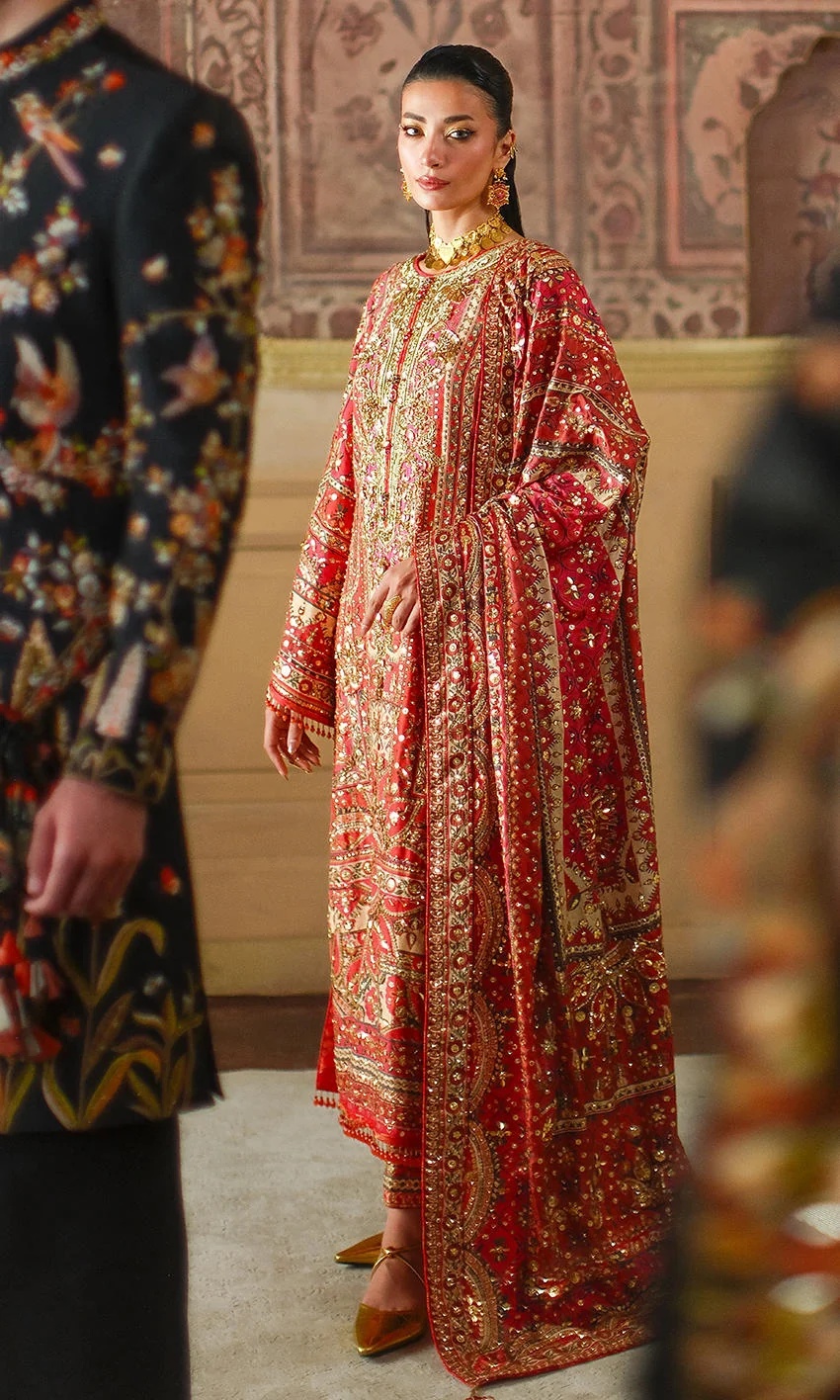 CRIMSON TALE I NOMI ANSARI clothing in gold, red tones.